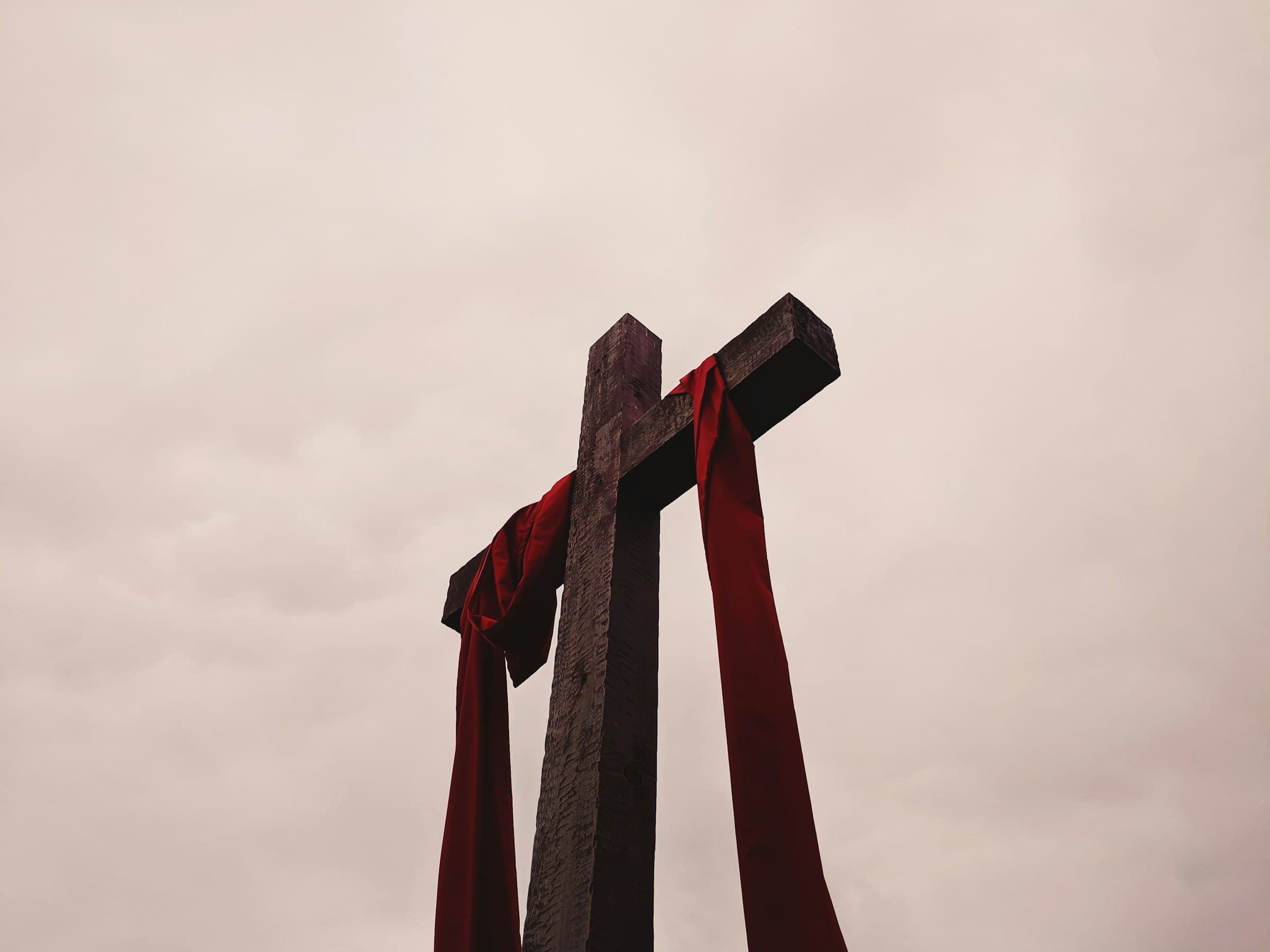 Cross with crimson sash drapery